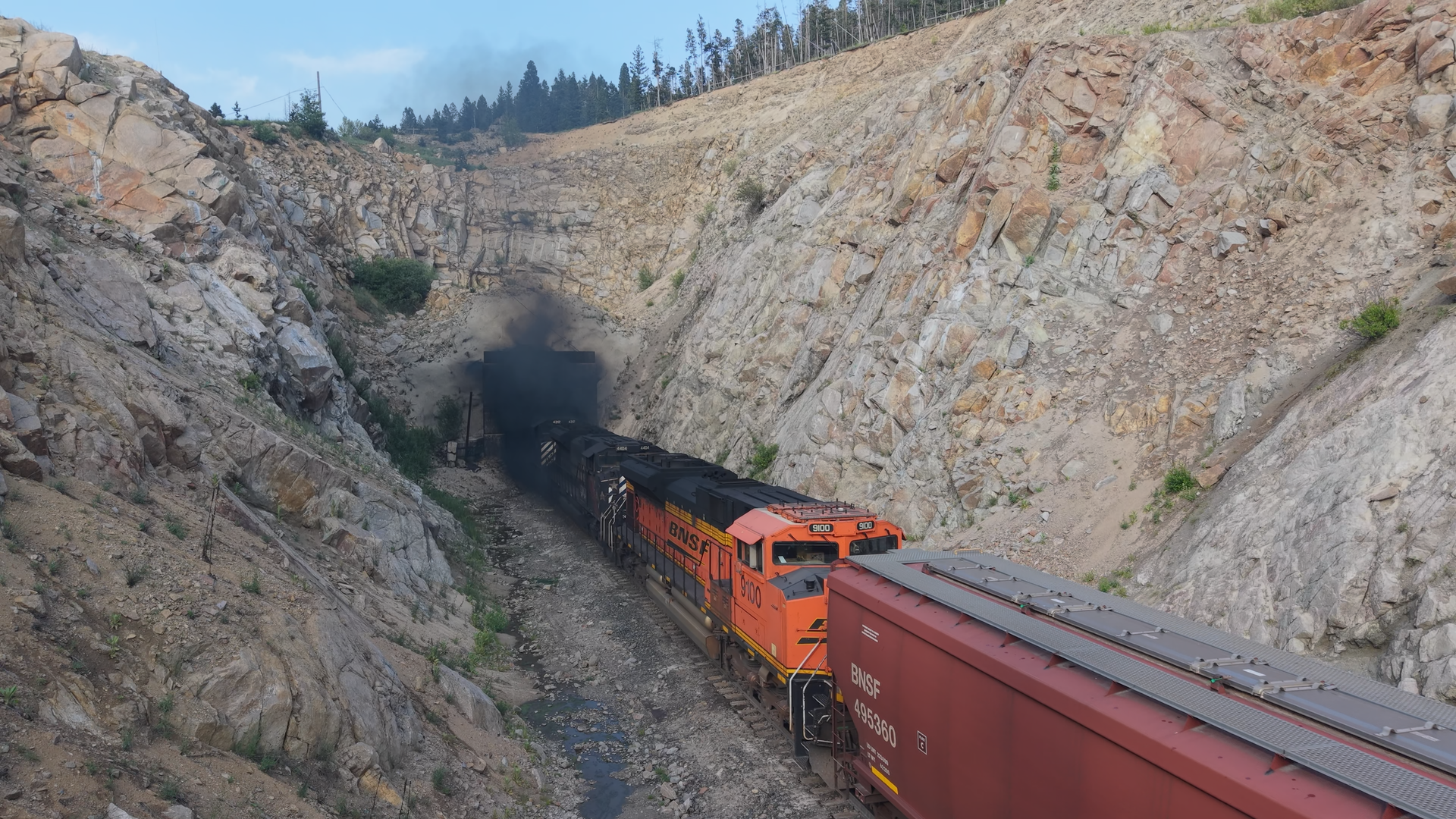 Drone shot of the helpers exiting the tunnel