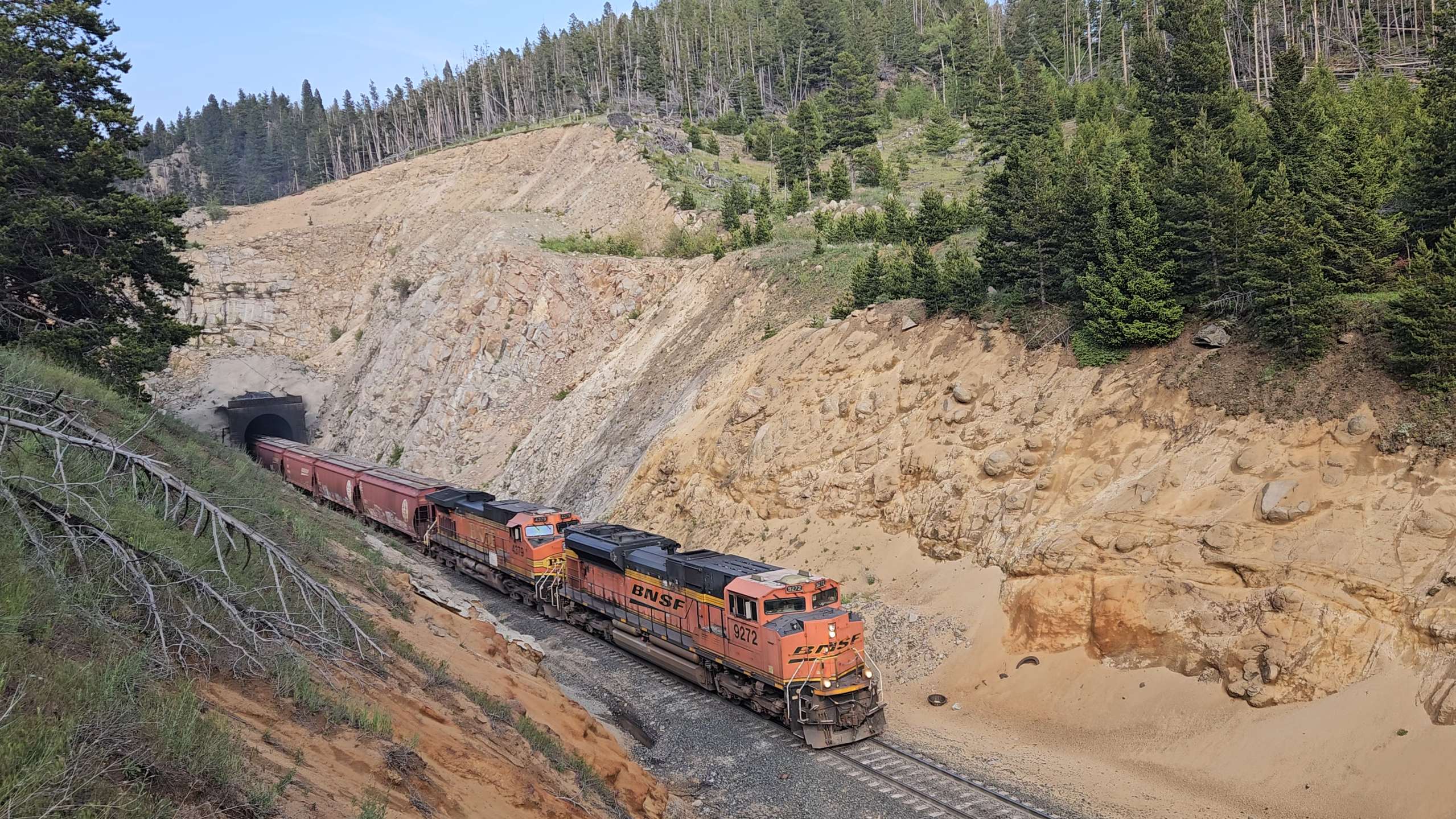 A westbound exiting the tunnel from the cliff side