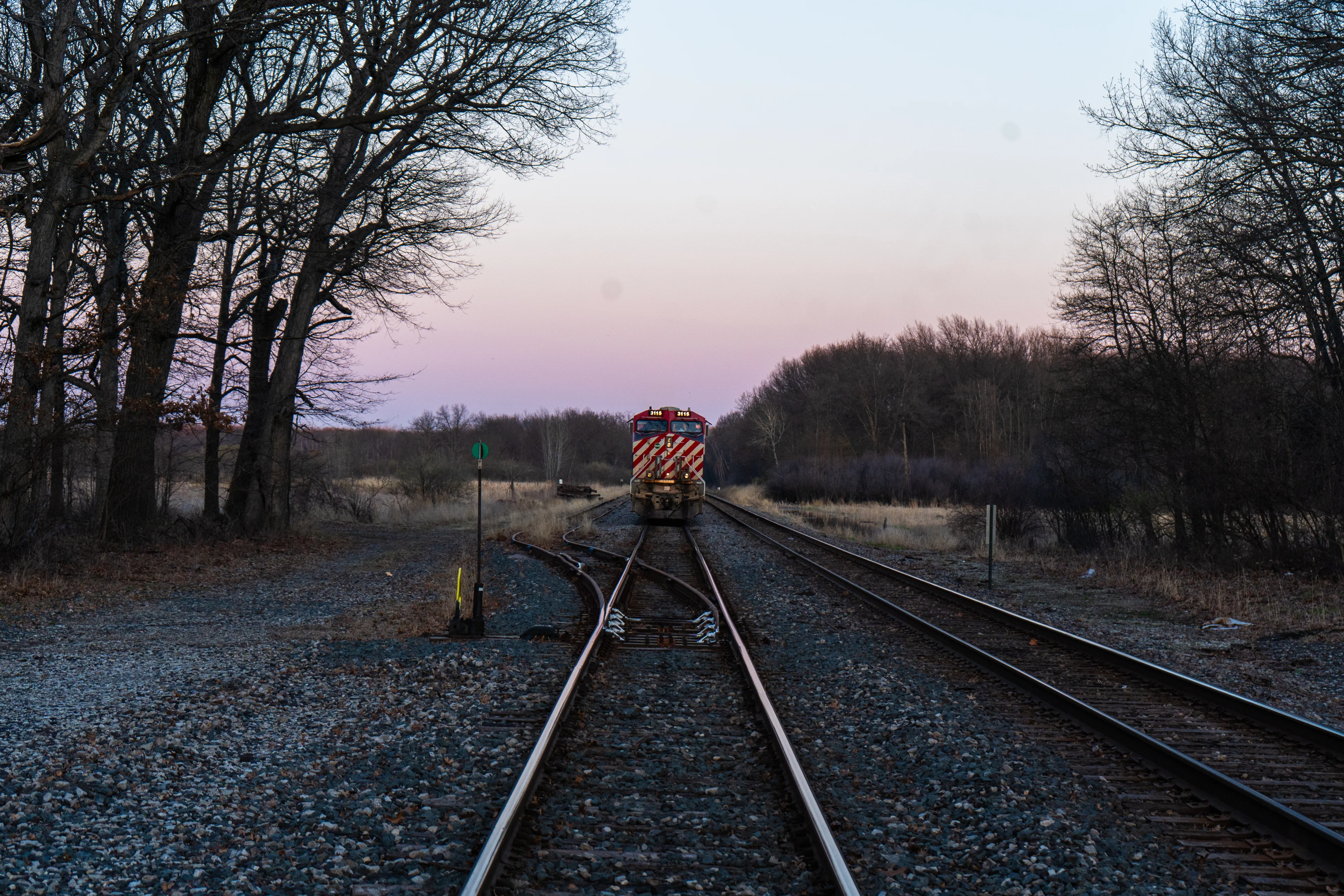Westbound CN manifest stopped shortly before the crossing with the CN BC rail heritage unit leading